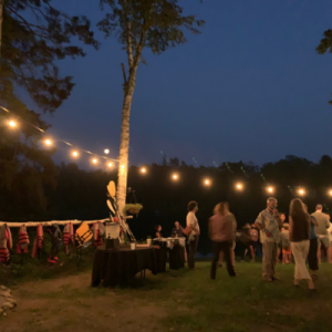 People socializing at an outdoor summer party.
