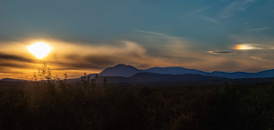 Sunset over a mountain landscape.