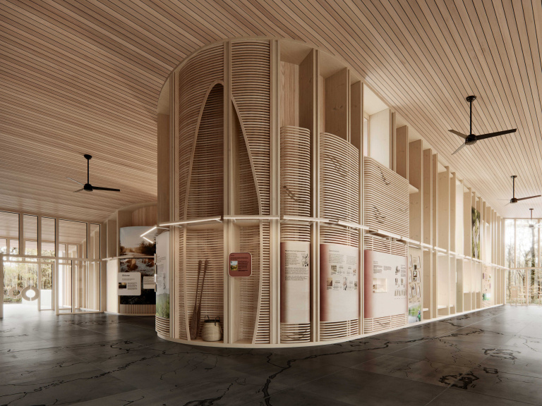 Modern interior featuring wood panels, curved structures, and informational displays in a spacious, well-lit area.