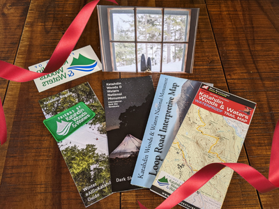 A display of maps, brochures, and stickers